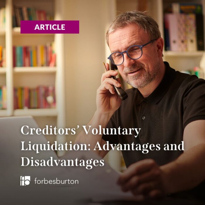 man on phone looking at documents