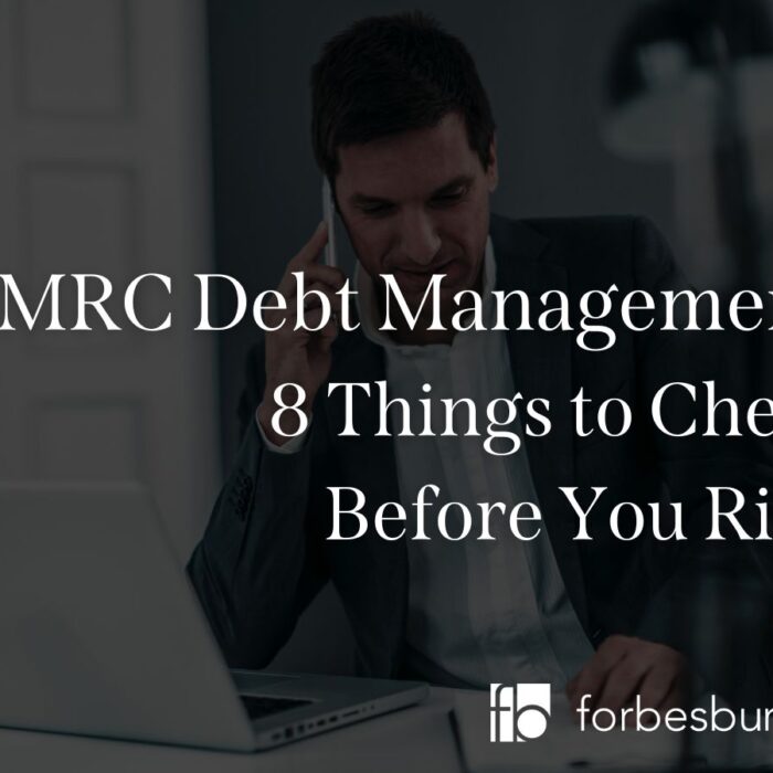 businessman making hmrc debt management call