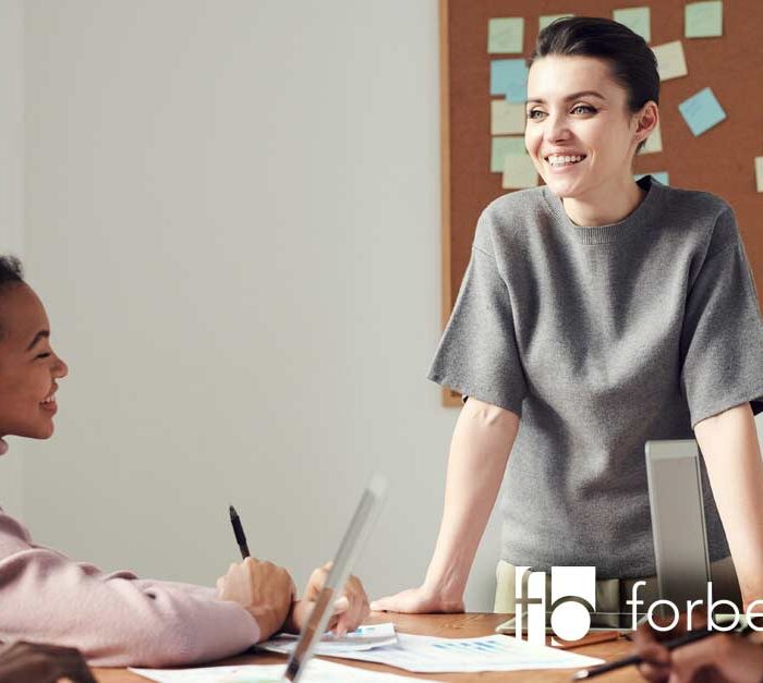 employees in meeting - building a supportive workplace culture