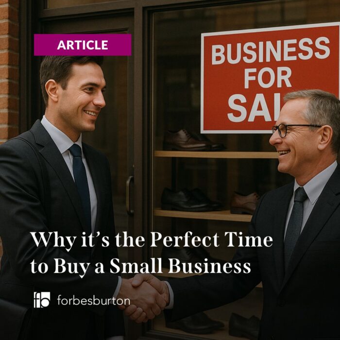 shaking hands after acquiring an SME