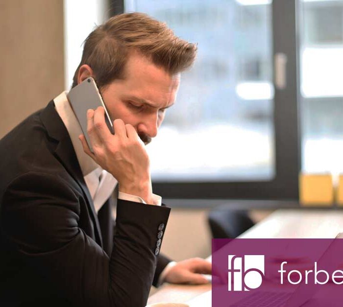 man holding phone company insolvency