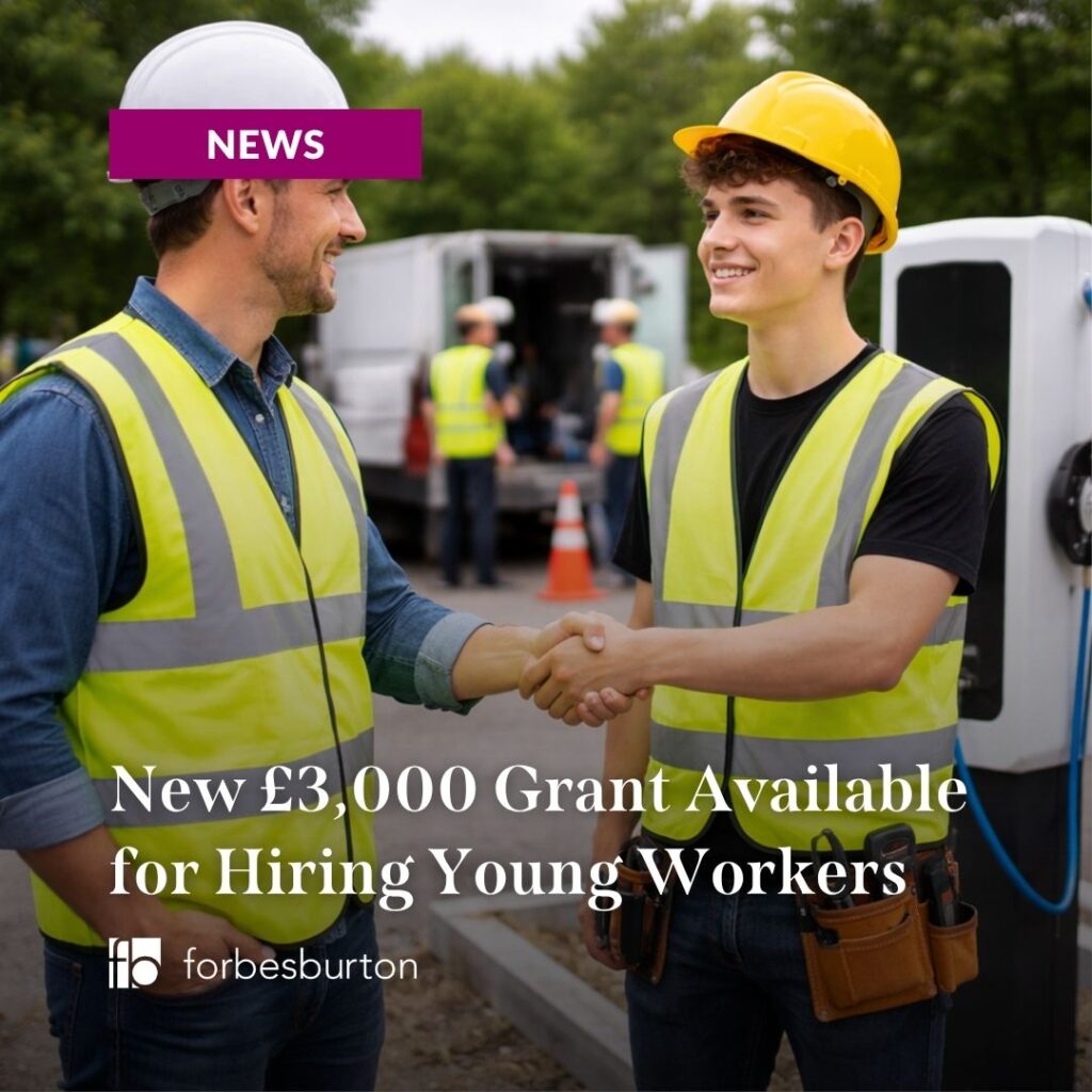 young worker on first day on job. he's got a hi-vis vesy and hard hat on