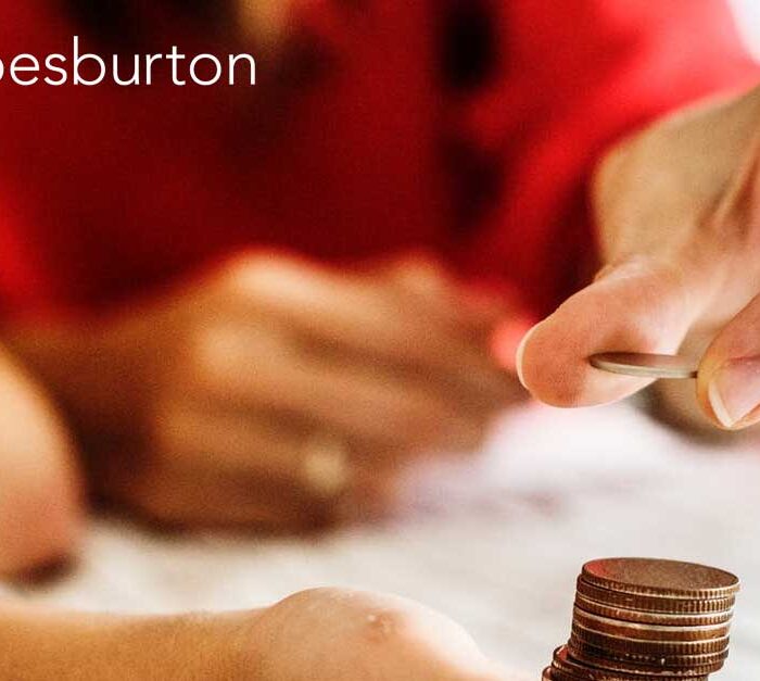 Person stacking 2p coins