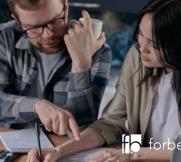 couple discussing how to reduce business debt