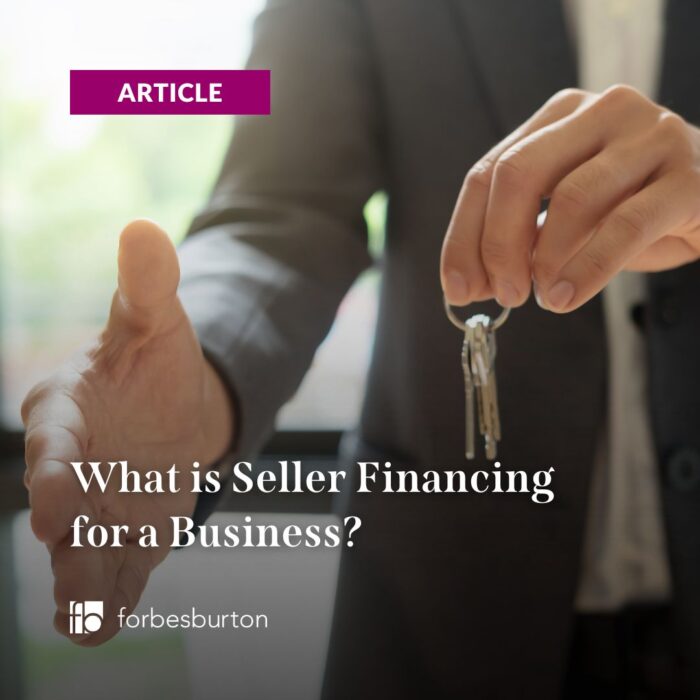 businessman with keys and a handshake