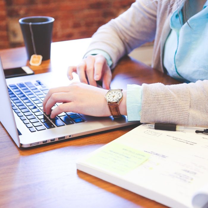 Business Man Typing on Laptop
