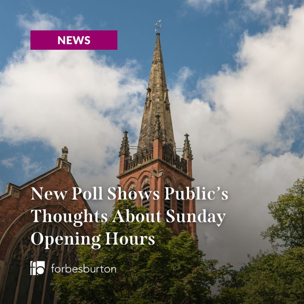 church spire behind tops of trees