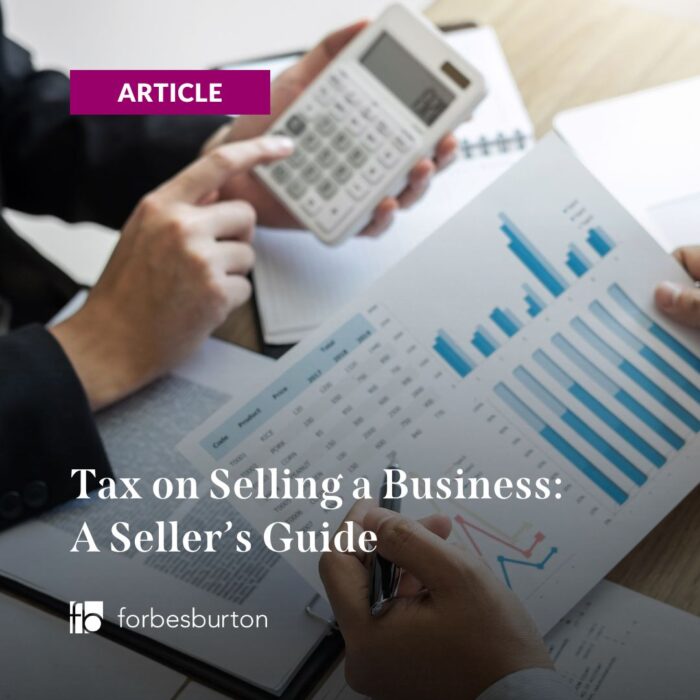 businesspeople figuring out the tax on selling a business
