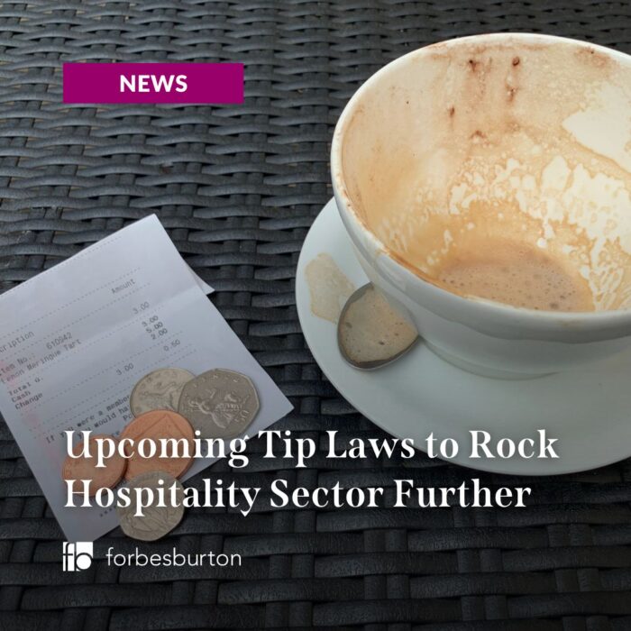 empty coffee cup with bill and coins next to it