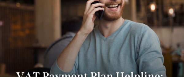 a chap looking happy on his mobile. Maybe he called our VAT payment plan helpline. Certainly looks like it