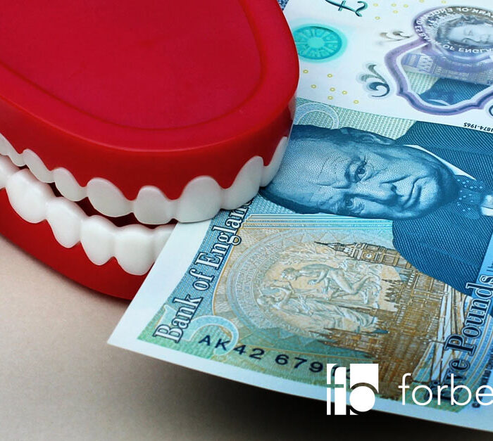 teeth biting into 5 pound note